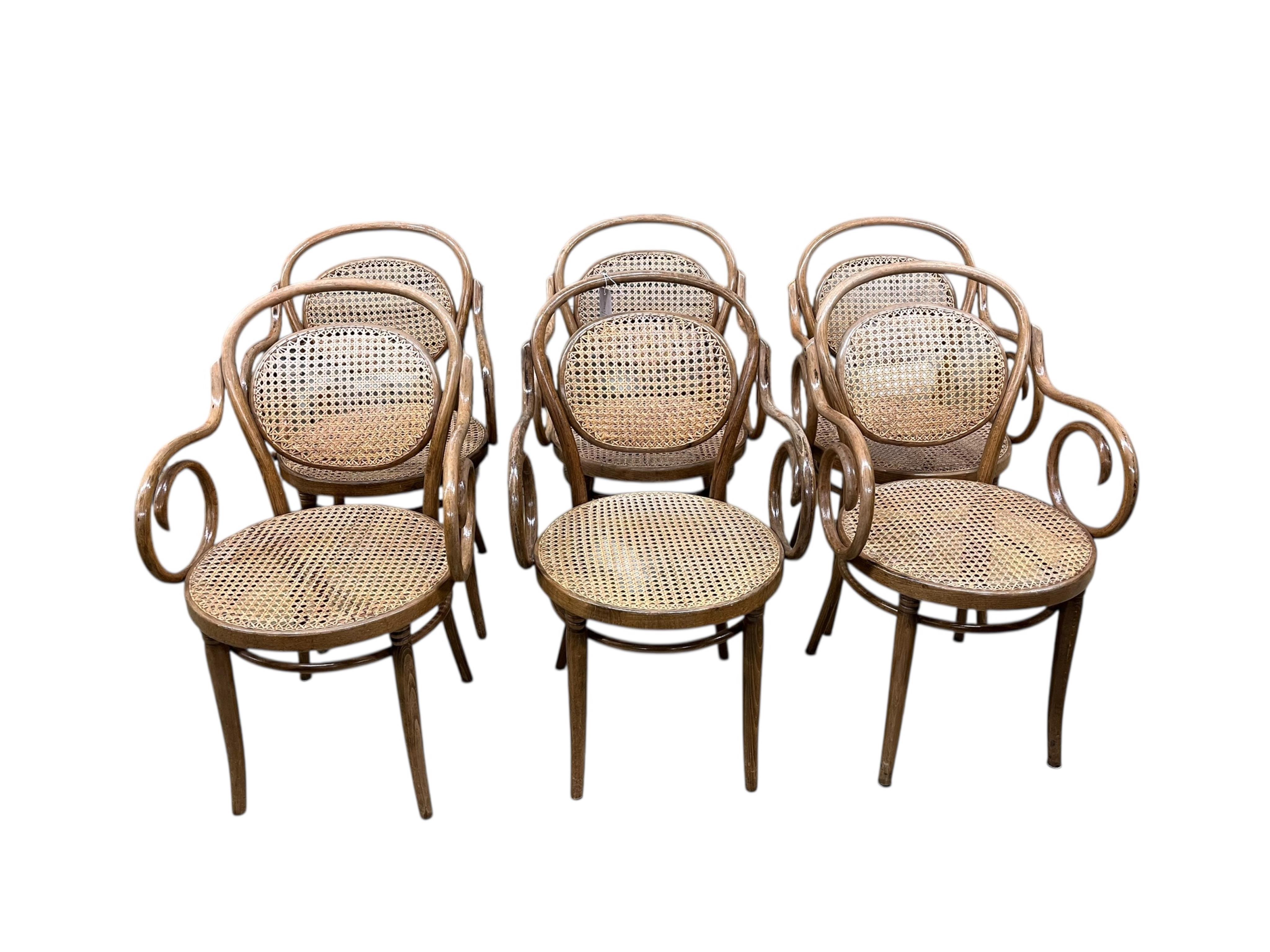 A Dinette caned beech and mahogany bentwood dining suite, comprising: dining table, width 180cm, depth 90cm, height 76cm and six elbow chairs